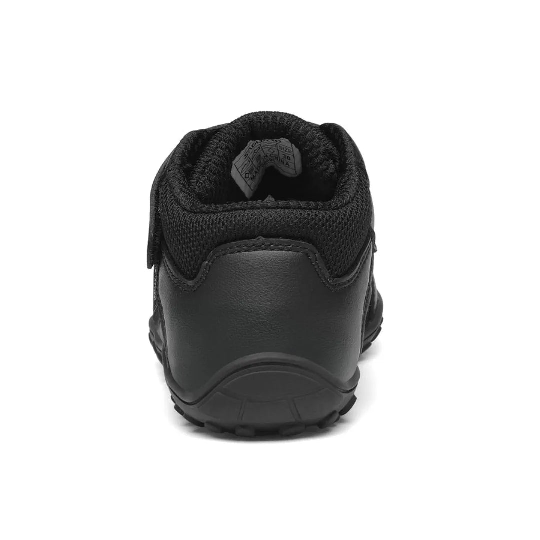 Vista trasera de botas minimalistas para niños Saguaro Kids sin contrafuerte rígido, respetando la movilidad del tobillo.