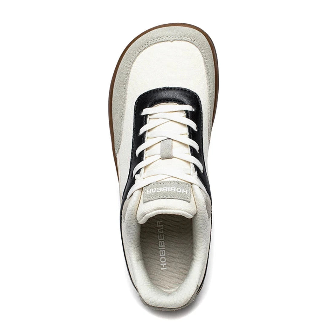 Vista superior de calzado barefoot resaltando su horma anatómica que respeta el espacio de los dedos.