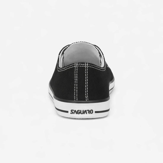 Detalle trasero de calzado barefoot urbano resaltando la estabilidad y el diseño de lona.