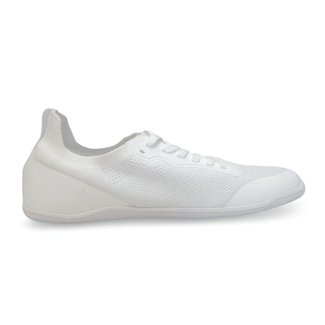 Zapatilla Sowilo Kenaz blanca vista lateral interna con acabado minimalista barefoot.