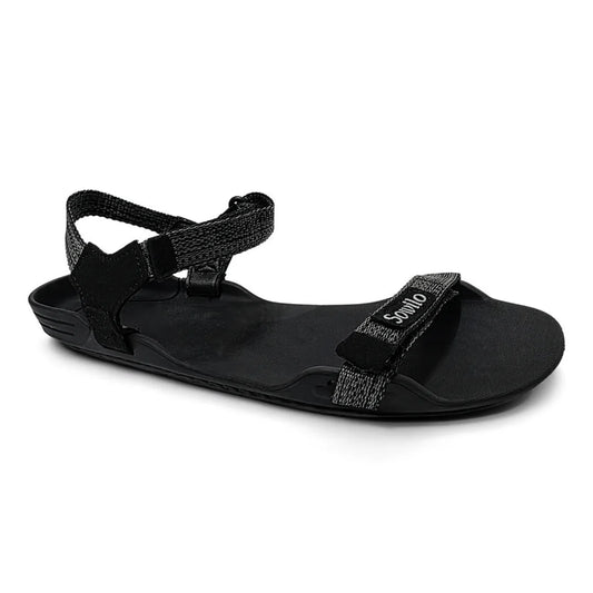 Sandalia barefoot Sowilo Raido negra vista lateral principal. 