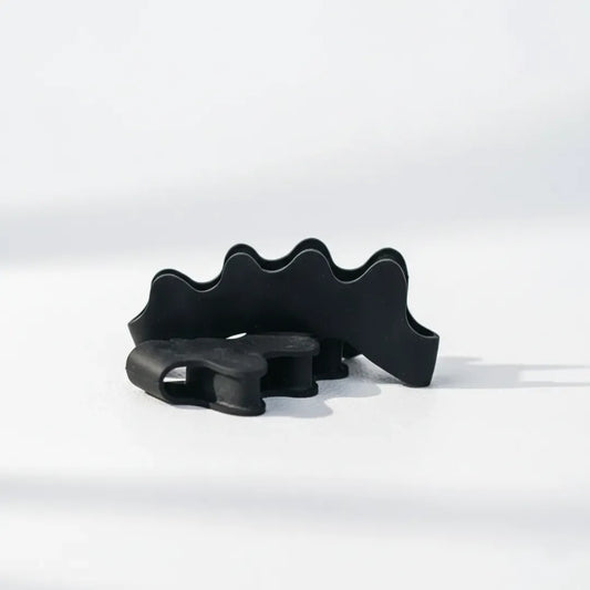 Separadores de dedos de silicona negra STARTER para pies y juanetes.