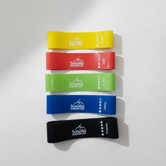 Cinco niveles de resistencia en bandas elásticas para una transición segura a zapatos barefoot.