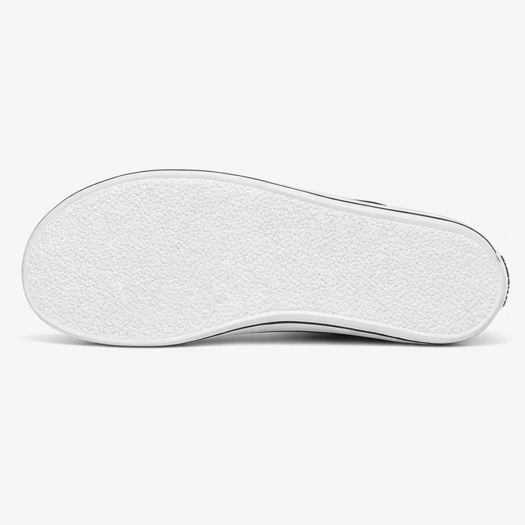 Suela de caucho blanca de un zapato barefoot con diseño zero drop y textura antideslizante.