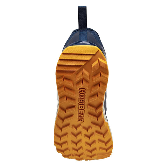 Suela de zapato minimalista con tacos multidireccionales para máxima tracción en exteriores.