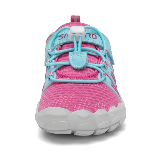 Zapatos bebé ergonómicos rosa con puntera reforzada y amplio espacio anatómico.