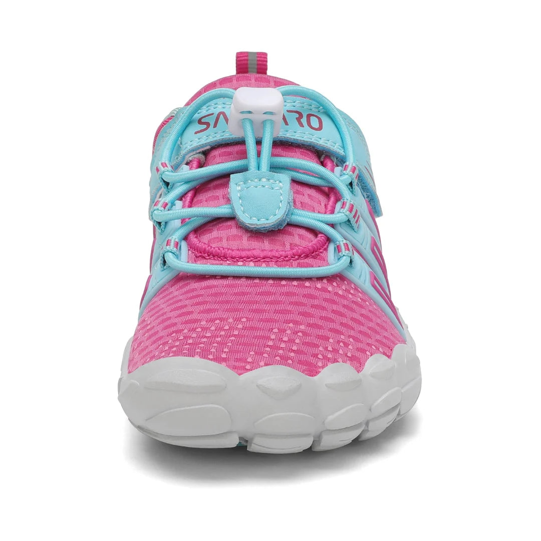 Zapatos bebé ergonómicos rosa con puntera reforzada y amplio espacio anatómico.