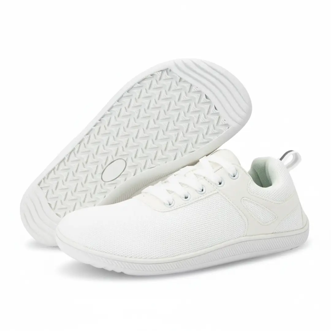 Suela flexible y vista lateral de la Comfy I blanca.