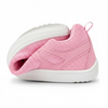 Zapatilla ZZfaber Comfy I rosa doblada mostrando flexibilidad barefoot.