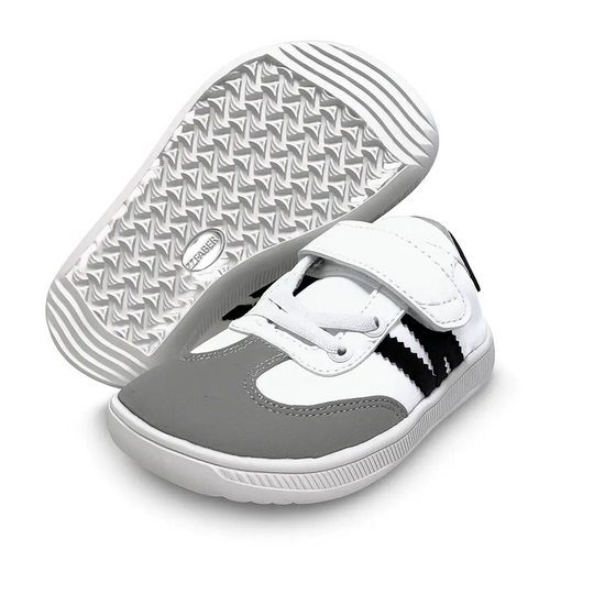 Suela flexible y antideslizante de la zapatilla barefoot infantil ZZfaber Kids Niza I blanco con negro.