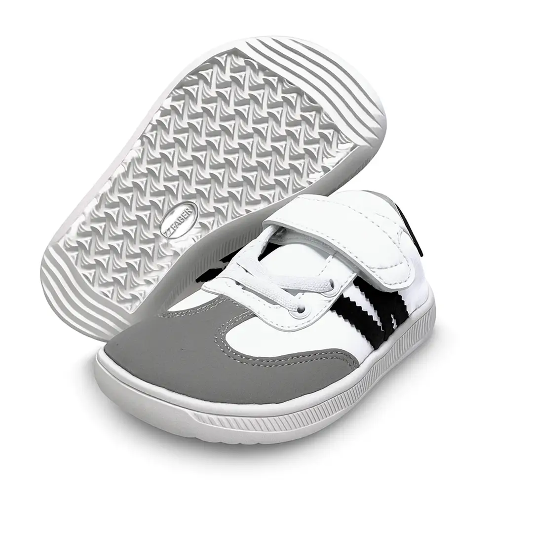 Suela flexible y antideslizante de la zapatilla barefoot infantil ZZfaber Kids Niza I blanco con negro.